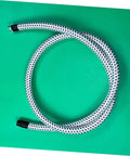 High Temp Steam Hose for Garment Steamers Flexible PVC Nylon Tube Replacement Part Durable Compatible With Most Ironing Machines Easy Install And Long Lasting Performance coiled on green background