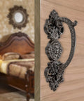 Heavy Duty 2 Pack 5.46 Inch Dark Brown Cast Iron Barn Door Handles Rustic Vintage Gate Fence Outdoor Garage Closet Cabinet Drawer Pulls Sturdy Rust Resistant Long Lasting With Retro Charm on a wooden door with a vintage bedroom setting.