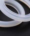 Close-up of 50mm Silicone Steam Ring Replacement Gasket for Breville and Krups Espresso Machines, food grade, BPA free, heat resistant.