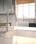 hansgrohe Talis N Pull Down Kitchen Faucet, Modern, Magnetic Hand Sprayer, 1-Handle, 1.75 GPM, Stainless Steel Optic, 72866801 with flowing water.