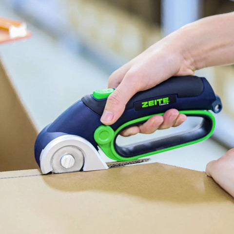 Zeite 4 V Cordless Electric Scissors Cardboard Cutter cutting through cardboard with easy grip handle for quick tasks.
