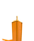 Close-up of orange Ultralight 7 Inch Aluminum Tent Stake with three-sided notch design for extra grip and reflective pull ropes.