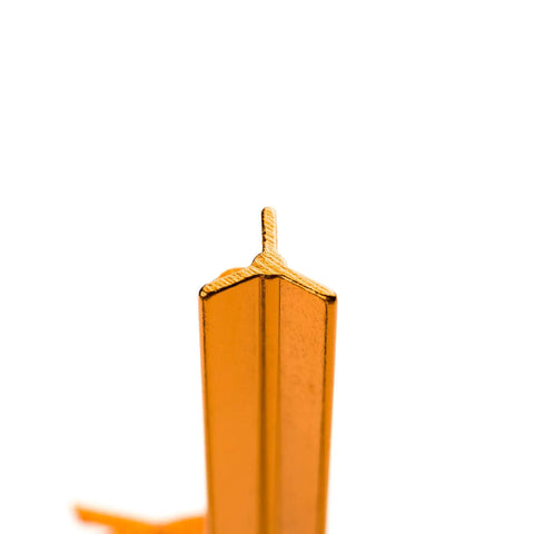 Close-up of orange Ultralight 7 Inch Aluminum Tent Stake with three-sided notch design for extra grip and reflective pull ropes.