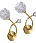 Modern Copper And Clear Crystal Glass Wall Sconces Featuring Slick Up And Down Lighting For Bathroom Vanity And Living Room Decor With Heavy Duty Build And Chill Ambient Vibes Two Pack close-up view with clear glass shades and gold accents.