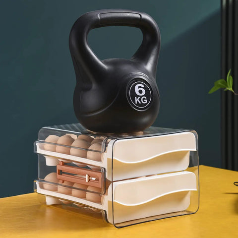32 Capacity Egg Holder For Fridge With Time Scale Two Drawer Egg Storage Container Bin Keeps Eggs Fresh And Easy To See And Grab In Your Kitchen with a kettlebell on top