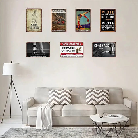 Safety First Eye Protection Required Metal Tin Sign 8x12 Inches displayed in living room with assorted vintage signs