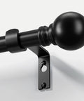 Black curtain rod with decorative finial, showing part of the bracket, 1 inch diameter. Heavy Duty Black Curtain Rods 72 To 144 Inches 1 Inch Diameter Adjustable Extra Long Blackout Traverse Window Rods With Decorative Finials For Living Room Bedroom Kitchen