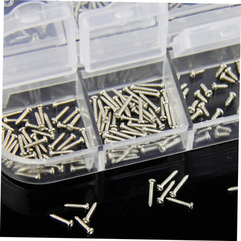 Close-up of tiny screws in a plastic storage case part of Eyeglass Repair Kit With 720 Pieces Screwdriver Set For Glasses Frames And Sunglasses