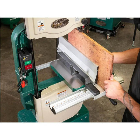 Heavy Duty Resaw Fence Upgrade For 14 Inch Bandsaws Featuring Quick Change Height Rails And Removable Alignment Blocks in use on a bandsaw with wood feeding.