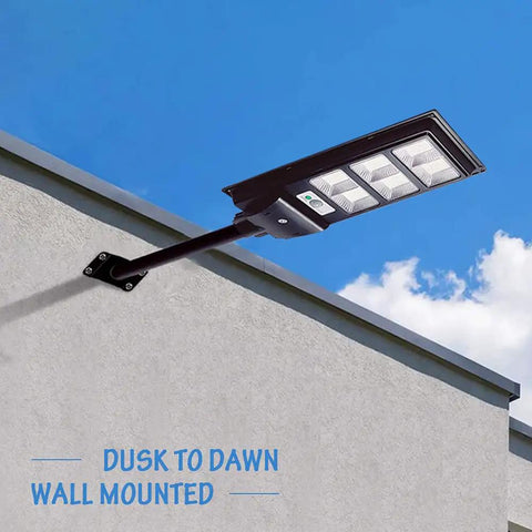 Two Pack Solar Street Lights Outdoor With Motion Sensor 10000LM Dusk To Dawn Flood Lights IP66 Waterproof LED Security Light mounted on wall