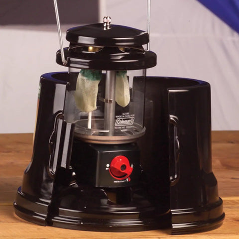 QuickPack Deluxe 1000 Lumen Propane Lantern with Carry Case, showing automatic lighting feature and open casing detail.