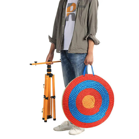 Man holding 20 Inch 5 Layer Traditional Straw Archery Target Hand Made 4 Inch Thick For Outdoor Shooting Practice With Silk Surface