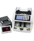 Heavy Duty Multi Currency Bill Counter Machine With Smart Fake Money Detector No Cap Precision For Smooth Cash Counting And Automatic Error Flagging Setup, featuring LCD display and currency rolls.