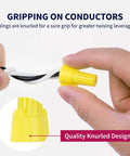 Close-up of hands twisting Yellow Winged Wire Connectors 500 Piece Set For AWG 18 To 10 Twist On Wire Nuts with knurled wings.