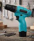 Built Tough 12V Cordless Drill With 25 Plus 1 Torque Settings And Dual Speed Modes in teal color on a workbench.
