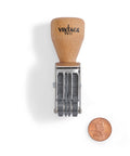 Vintage Pro Heavy Duty Date Stamp Workhorse featuring adjustable MMM DD YYYY format with wood grip and penny for size reference.