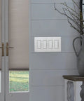 4 Gang White Screwless Wall Plate Cover For Decorator Rocker Light Switches And Outlet Covers Gloss Finish Easy Snap On Install Durable Plastic Wall Plate Fits Decorator Switches CW 4 WH installed in a modern living room setting.