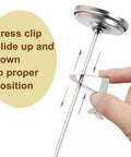 Close-up of Milk Frothing Thermometer For Coffee And Chocolate Pro Grade Stainless Steel Temp Gauge with hand adjusting clip