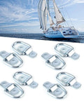Eight Piece Rock Solid Tie Down D Ring Load Anchors With Heavy Duty Forged Iron Lashing Rings And Simple Mounting Brackets For Truck Trailer Boat Cargo Securing 1000 Kg Capacity No Sweat Setup arranged beside a boat.