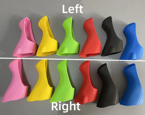 Assorted colorful silicone brake lever hoods for road shifters ST R2000 R3000 R3030, showing left and right pairs on a table.