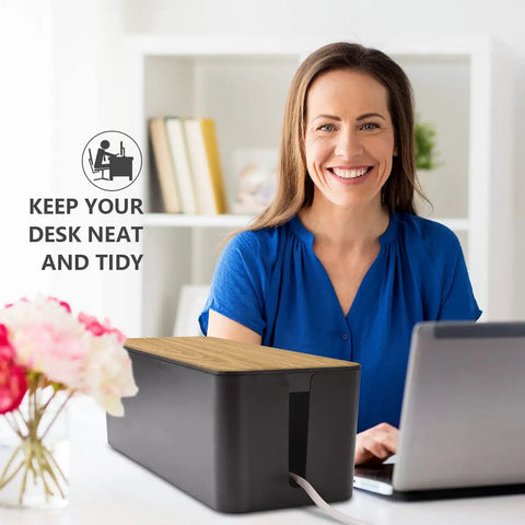 Woman using Large Wood Grain Cable Management Box To Hide Wires And Power Strips For TV Desk And Computer Cables Keeps Your Setup Clean Includes Cable Clips And Reusable Cable Ties For Home And Office Black on desk