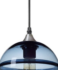 Close-up of hand blown glass pendant light in modern blue with brushed nickel globe, part of a 7.4 inch diameter three pack set.