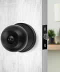 Matte Black Privacy Door Knobs Set 8 Pack With Turn Button Lock And Emergency Coin Unlock, Keyless Inside Handle on wooden door.