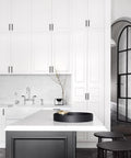 Modern kitchen with white cabinets featuring 30 Pack Black Kitchen Cabinet Handles, 5 Inch Square Steel Cabinet Pulls.