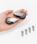 Hella Smooth Silent TPE Fixed Caster Wheels Two Pack Built Like Iron Black Nonmarking Heavy Duty Rollers in hand with screws.