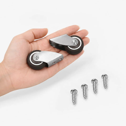Hella Smooth Silent TPE Fixed Caster Wheels Two Pack Built Like Iron Black Nonmarking Heavy Duty Rollers in hand with screws.