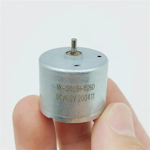 Hand holding Dope Tiny 24mm Mini Electric Motor Spindle for DIY Projects, visible text on motor casing.