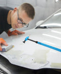 Pro Grade Multi Head Paintless Dent Removal Hammer Kit used on car hood with a user applying precision repairs.