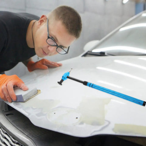 Pro Grade Multi Head Paintless Dent Removal Hammer Kit used on car hood with a user applying precision repairs.