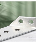 Close-up of Beefy Heavy Duty Stainless Steel Angle Brackets 4 Pack For Shelves And Wall Mounts Scratch Resistant hardware.