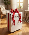 Elegant white 899-Piece Rolling Tool Cart wrapped with a red bow, displayed in a cozy room with wooden flooring.