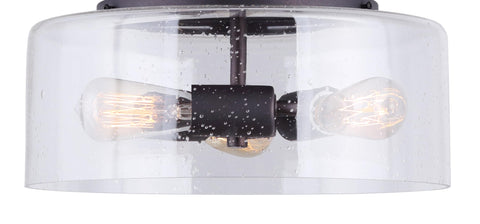 Nash 3 Bulb Semi Flush Light With Seeded Glass in Oil Rubbed Bronze Finish, showing Edison bulbs against a clear seeded glass shade.