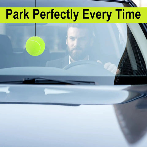 Garage Parking Aid Ball System For Home Garages, Parking Guide Kit hanging in front of car windshield with driver visible