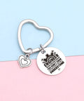 Heart-shaped stainless steel keychain on pastel background with engraved 'Engineer' text for Engineering Student Gift Keychain For Graduation Cool Mechanical Engineer Jewelry For Coworkers And Students Software And Hardware Nerds Will Love Engraved Stainless Steel Gift For Engineering School Grad.