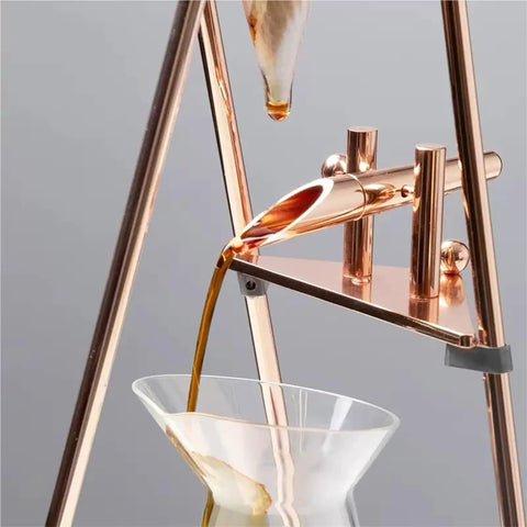 Top Shelf Cold Brew Drip Tower And Ice Drip Coffee Maker With 800Ml Borosilicate Glass Carafe pouring coffee into glass.