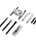 Thinking Process: 9-piece steel bearing splitter puller kit with bolts and jaws for removing wheel hub bearings