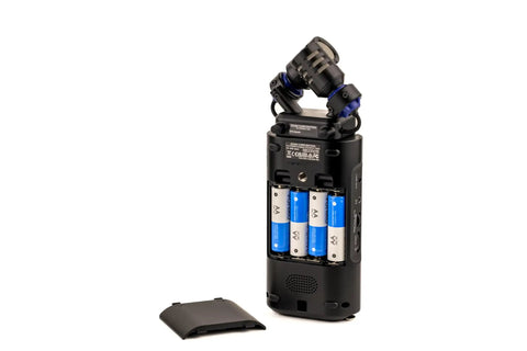 Back view of a Handheld Studio Recorder For Musicians Podcasters And Filmmakers With Large Stereo Microphones Pro Quality Preamps, showing battery compartment.