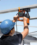 Heavy Duty Magnetic Base Drill Built Tough For One Quarter Inch Steel Cuts being operated on steel beams.