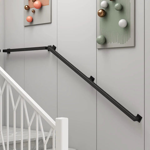 12 Ft Matte Black Wrought Iron Wall Mount Railing Beast Mode Heavy Duty Non Slip Handrail for Stairs Porch Deck Supports 440 Lbs Corrosion Resistant Indoor Outdoor Banister Bad Ass Grip mounted on a wall.