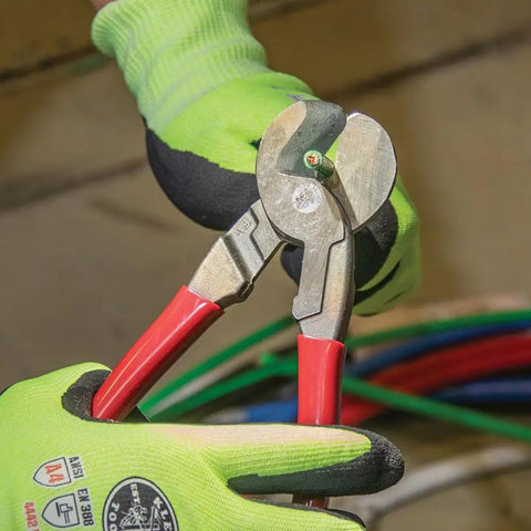 Worker using Beefy 9-Inch High Leverage Cable Cutter For Aluminum Copper And 100-Pair Communications Cable Made In USA Precision One-Hand Shear Cable-Gripping Jaws Built For Tight Spaces on colored wires.
