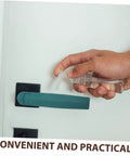 Person using a spray bottle on a durable commercial oven handle for baking dryer with a green heat-resistant grip.