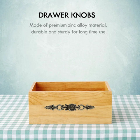 Antique Bronze Cabinet Pulls 6.88 Inch Zinc Alloy Wardrobe Drawer Handles Vintage Carved Hardware on wooden drawer.