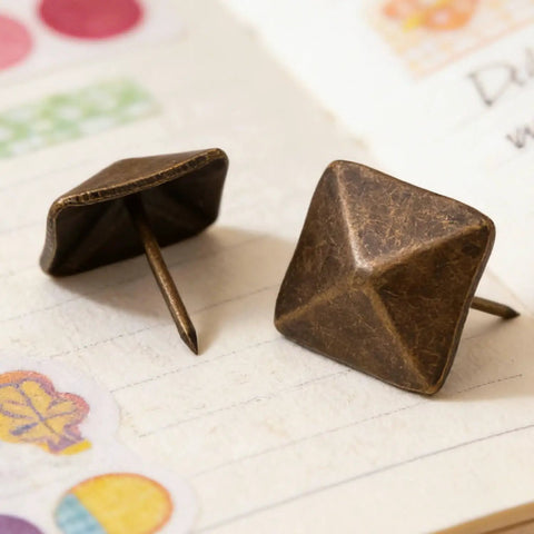 Top Shelf Antiqued Brass Upholstery Nails With Dang Sharp Square Cone Heads Heavy Duty Furniture Tacks Pack Of Thirty on notebook