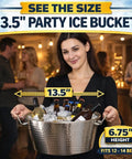 Woman holding a 13.5-inch hammered stainless steel beverage tub with ice and drinks, double-walled insulation, party setting.