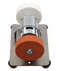 Mini Electric Belt Sander And Knife Sharpener Loaded With A Kickass 96W Brushless Motor Chugging 6000 RPM top view of the motor and sanding wheels.