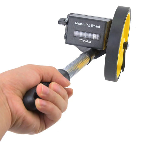 LiebeWH Measuring Wheel 0-9999.9m Telescopic Handle 0.5% Accuracy held in hand, black and yellow with digital display.